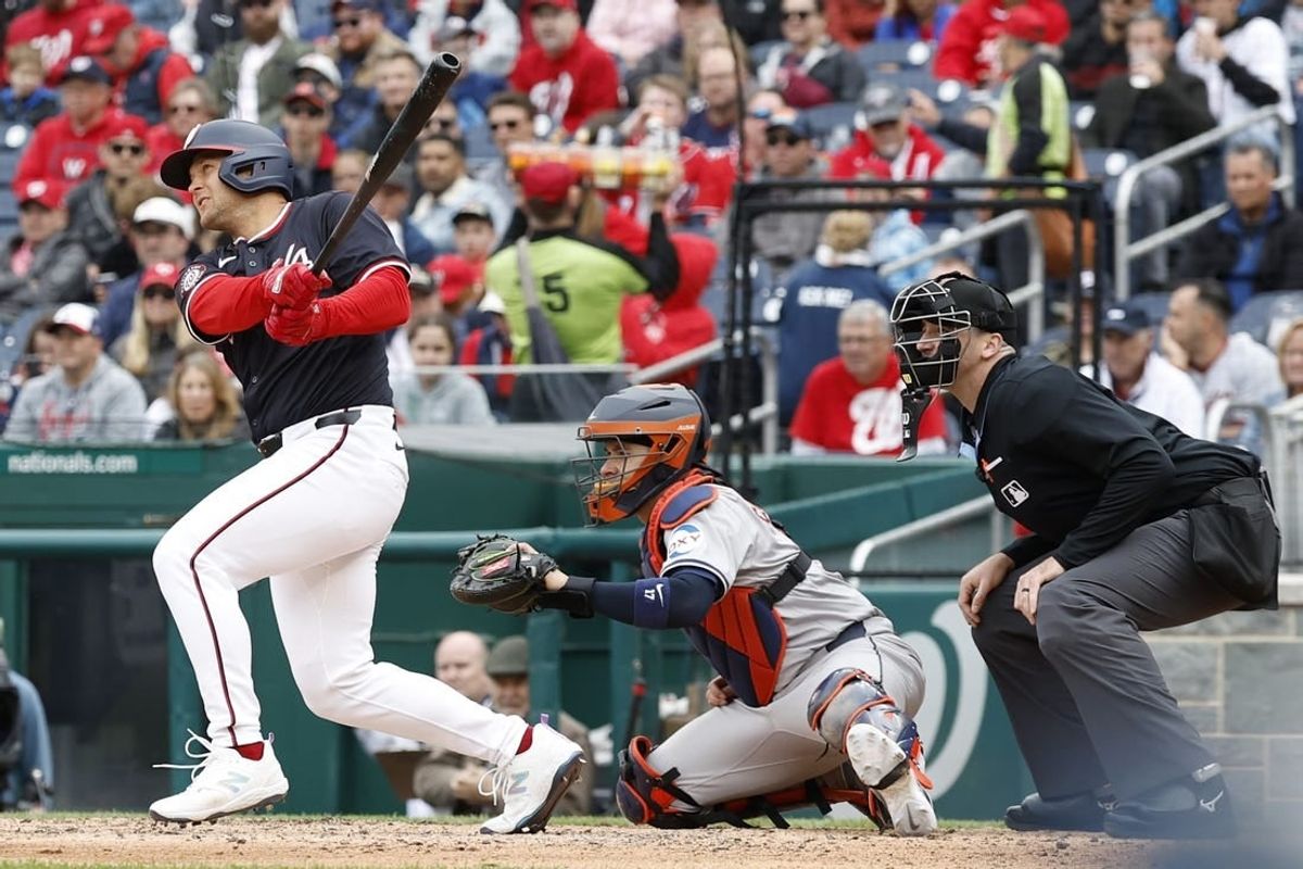 Apr 21, 2024; Washington, District of Columbia, USA; Washington Nationals third base Nick Senzel (13) hits a home run against the Houston Astros during the sixth inning at Nationals Park.