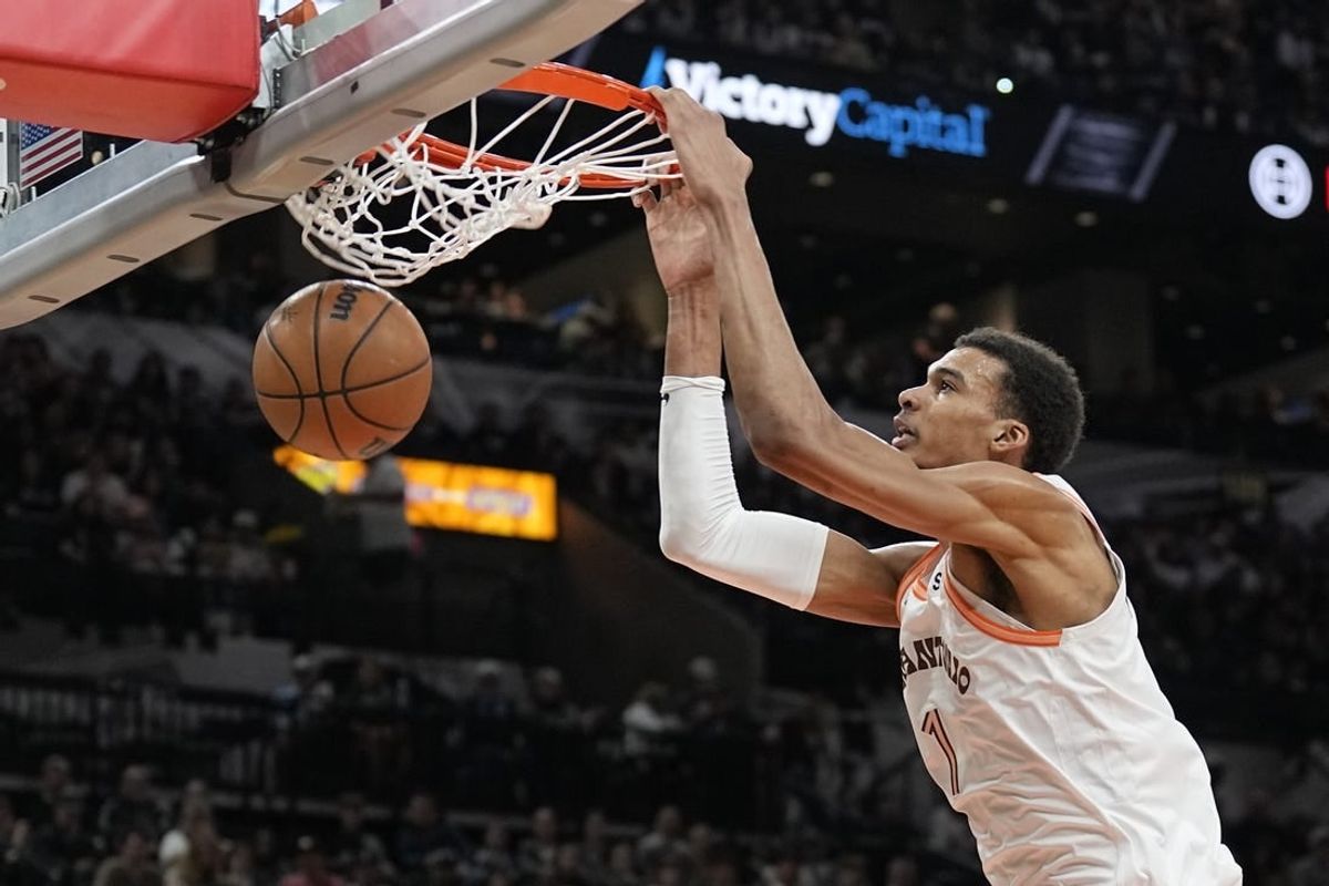 Feb 3, 2024; San Antonio, Texas, USA; San Antonio Spurs forward Victor Wembanyama (1) dunks during the first half against the Cleveland Cavaliers at Frost Bank Center.