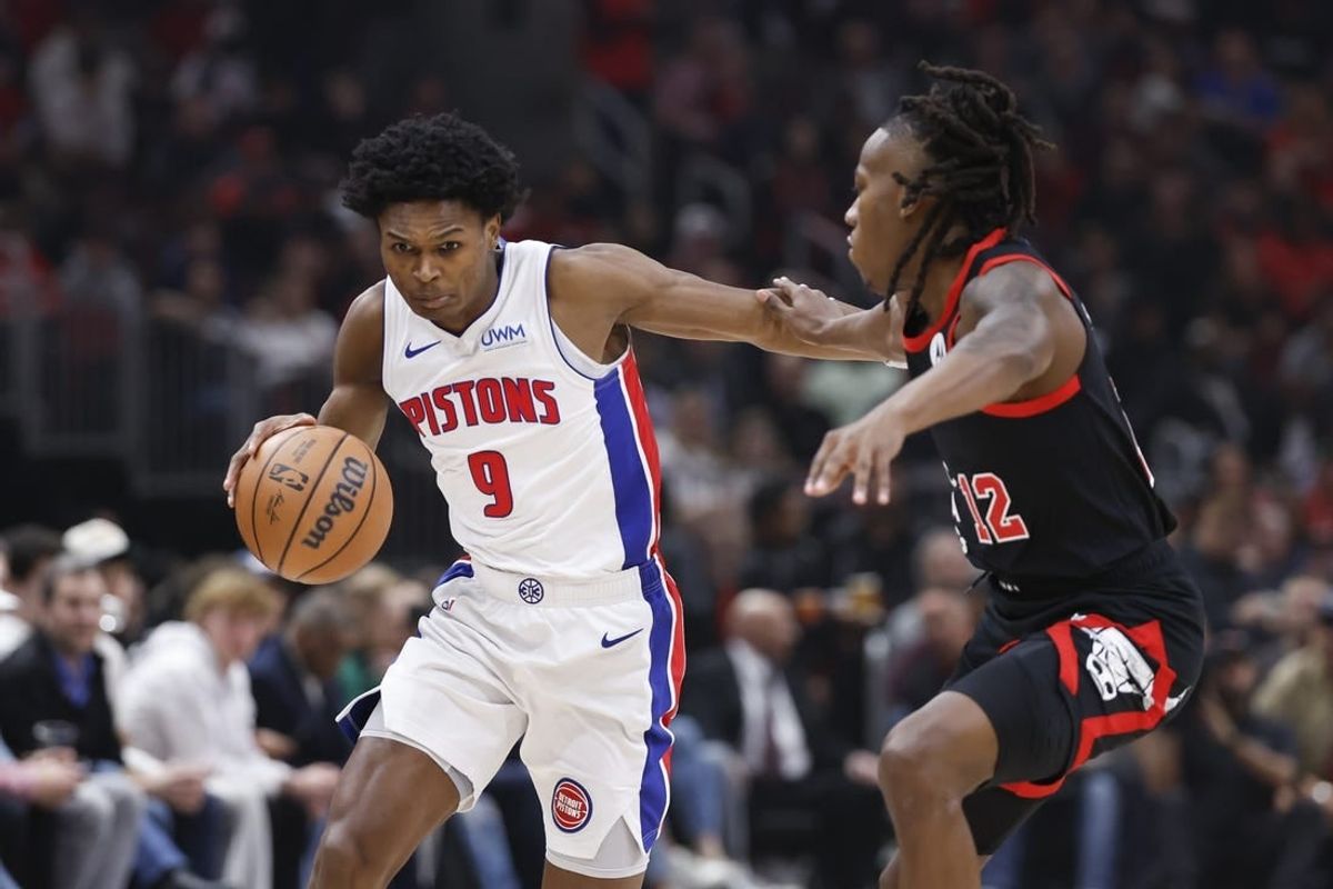 Feb 27, 2024; Chicago, Illinois, USA; Detroit Pistons forward Ausar Thompson (9) drives to the basket against Chicago Bulls guard Ayo Dosunmu (12) during the first half at United Center.