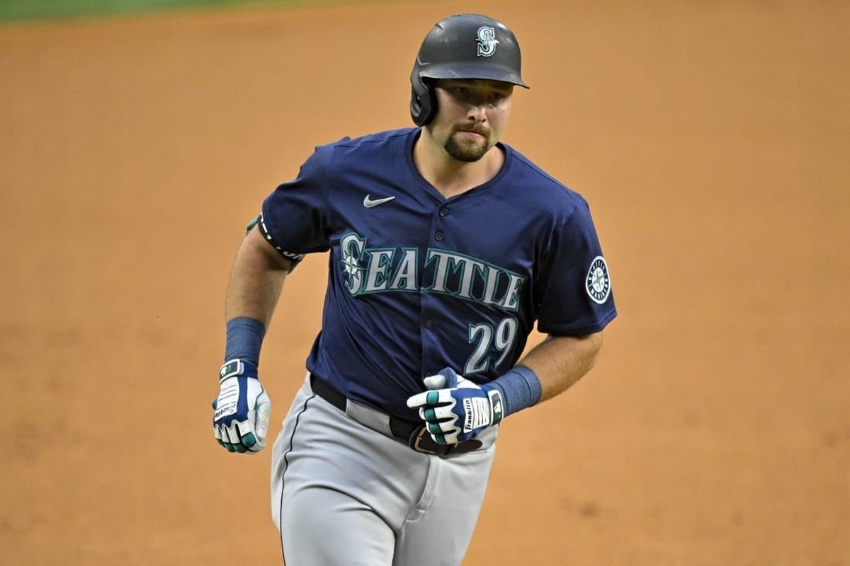 Apr 23, 2024; Arlington, Texas, USA; Seattle Mariners catcher Cal Raleigh (29) rounds the bases after he hits a two run home run against the Texas Rangers during the first inning at Globe Life Field.