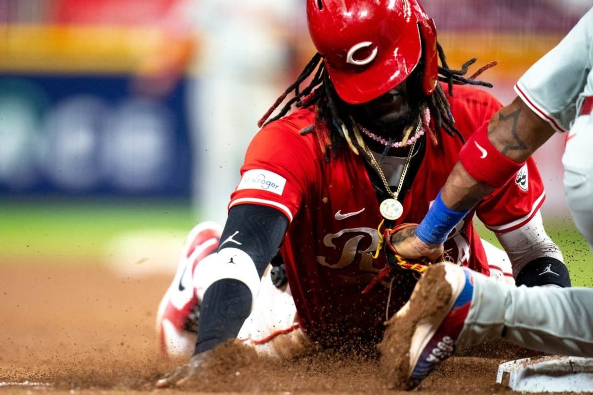 Cincinnati Reds shortstop Elly De La Cruz (44) steals third base as Philadelphia Phillies third base Edmundo Sosa (33) attempts to stop him in the eighth inning of the MLB baseball game between the Cincinnati Reds and the Philadelphia Phillies at Great American Ball Park in Cincinnati on Wednesday, April 24, 2024.