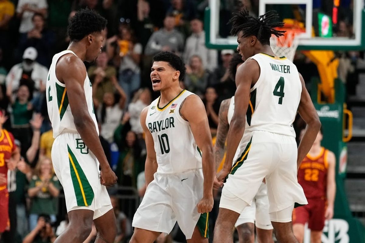 Feb 3, 2024; Waco, Texas, USA; Baylor Bears guard RayJ Dennis (10) celebrates with teammates after scoring a three point basket against the Iowa State Cyclones during the second half at Paul and Alejandra Foster Pavilion.