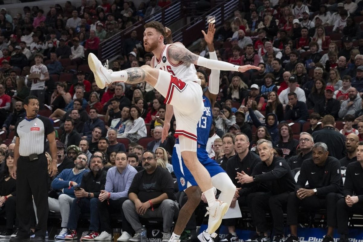 Mar 14, 2024; Chicago, Illinois, USA;  Chicago Bulls forward Onuralp Bitim (17) defends against LA Clippers forward Paul George (13) during the first half at the United Center.
