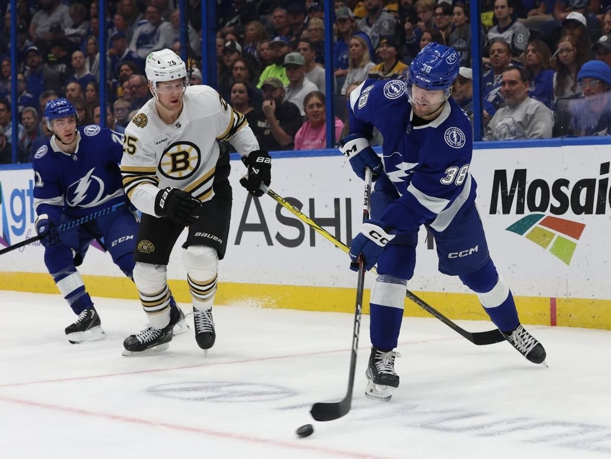 Nov 20, 2023; Tampa, Florida, USA; Tampa Bay Lightning left wing Brandon Hagel (38) passes the puck against the Boston Bruins during the first period at Amalie Arena.