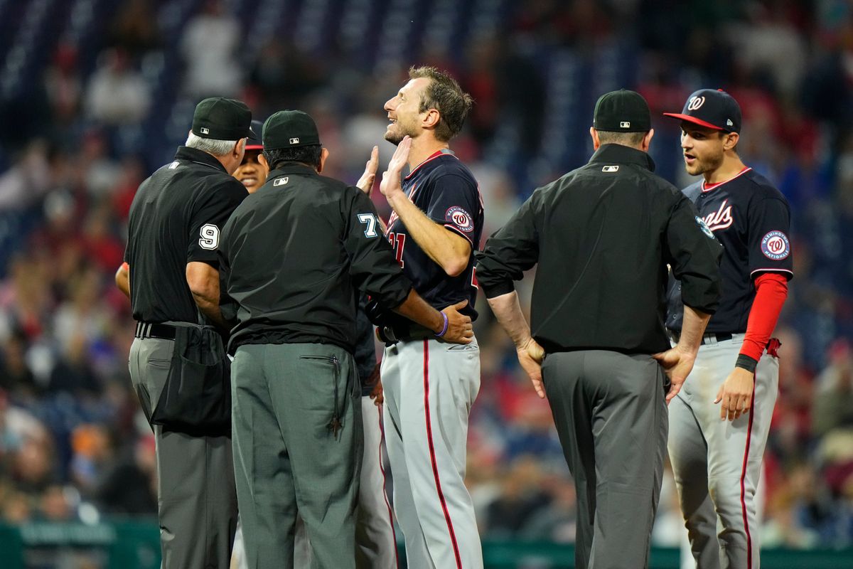 Umps get a little handsy with Max Scherzer.