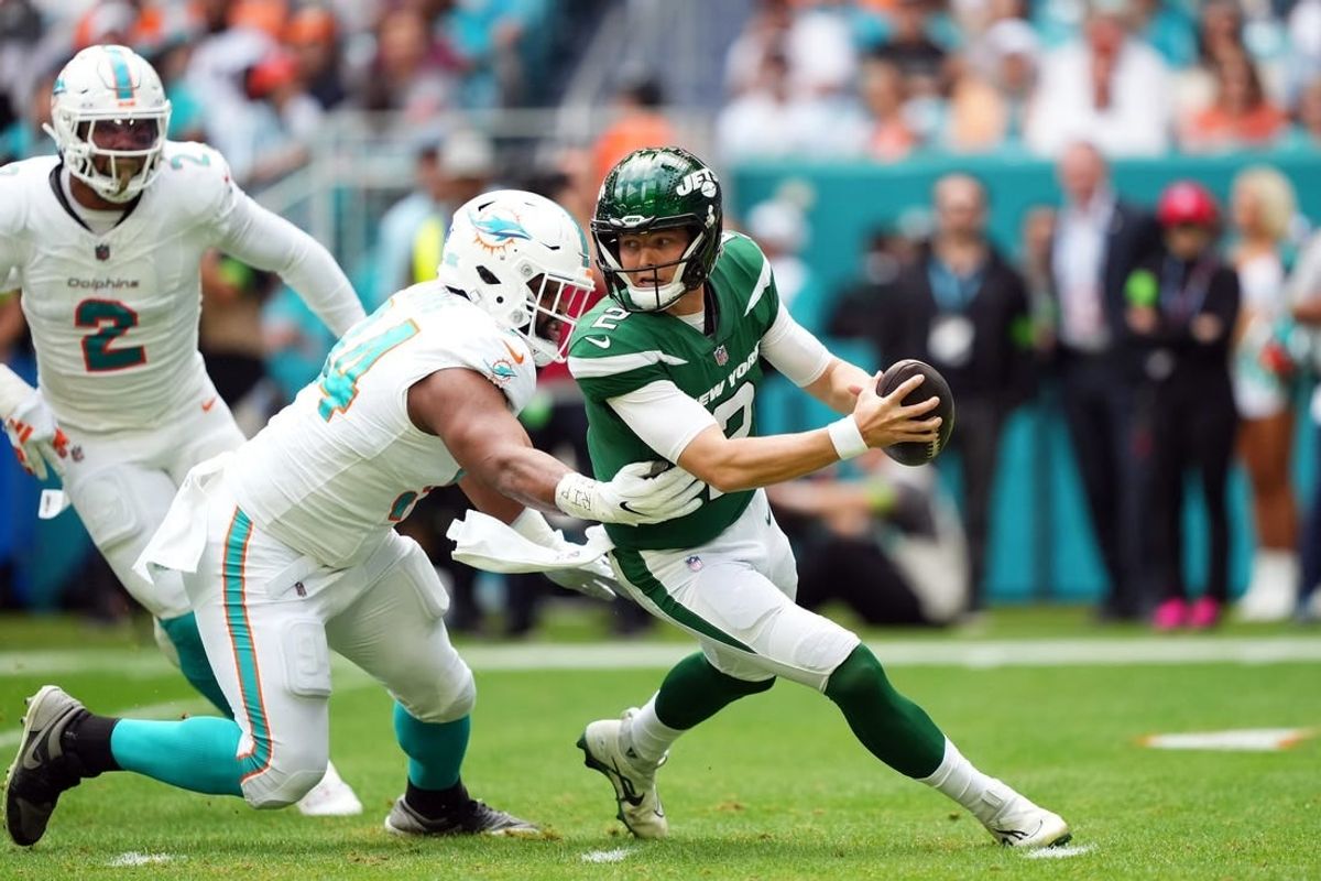 Dec 17, 2023; Miami Gardens, Florida, USA; Miami Dolphins defensive tackle Christian Wilkins (94) rushes in on New York Jets quarterback Zach Wilson (2) during the first half at Hard Rock Stadium.