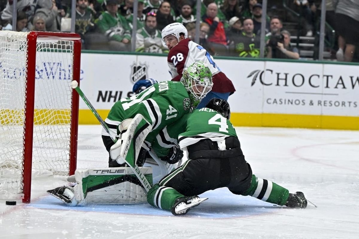 Jan 4, 2024; Dallas, Texas, USA; Dallas Stars defenseman Miro Heiskanen (4) collides with goaltender Scott Wedgewood (41) as they face a shot by Colorado Avalanche left wing Miles Wood (28) during the third period at the American Airlines Center.