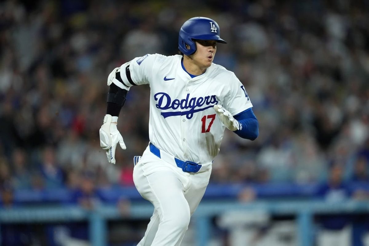 Apr 1, 2024; Los Angeles, California, USA; Los Angeles Dodgers designated hitter Shohei Ohtani (17) rounds the bases on a double in the third inning against the San Francisco Giants at Dodger Stadium.