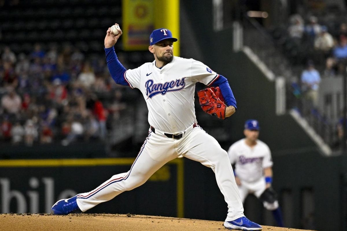 May 2, 2024; Arlington, Texas, USA; Texas Rangers starting pitcher Nathan Eovaldi (17) pitches against the Washington Nationals during the first inning at Globe Life Field.