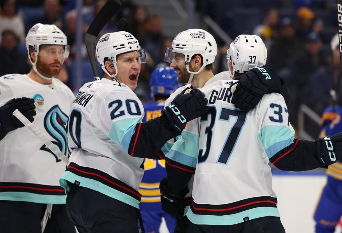 Jan 9, 2024; Buffalo, New York, USA;  Seattle Kraken center Yanni Gourde (37) celebrates his goal with teammates during the first period against the Buffalo Sabres at KeyBank Center.