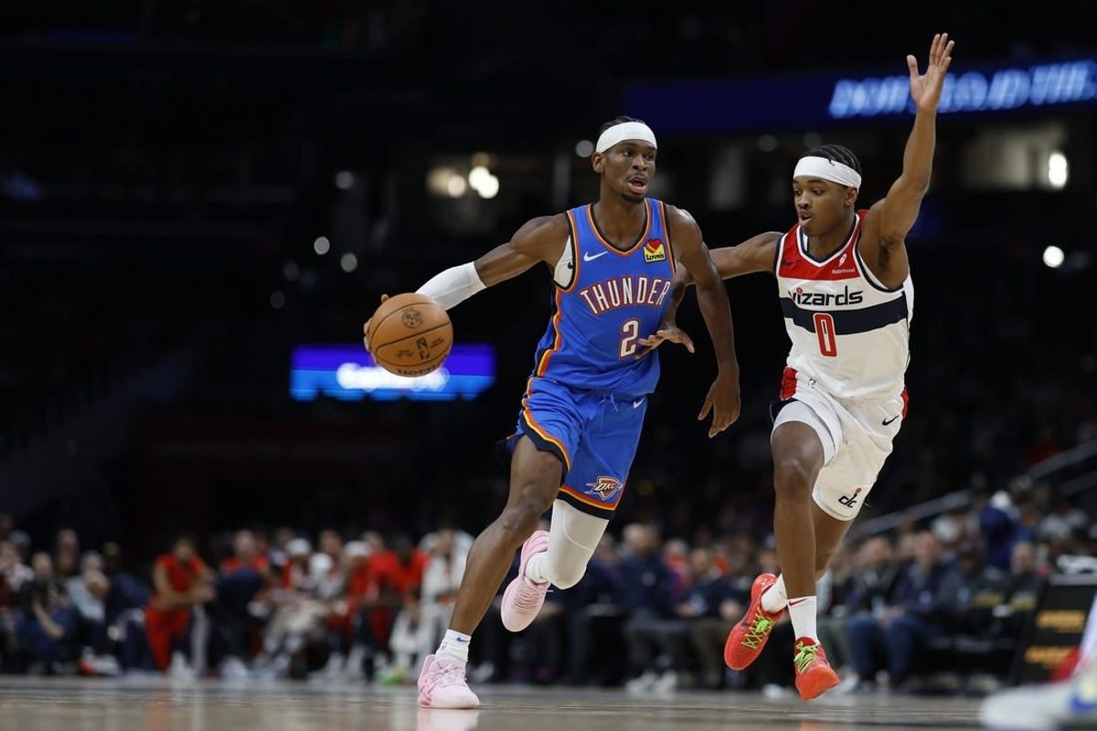 Jan 8, 2024; Washington, District of Columbia, USA; Oklahoma City Thunder guard Shai Gilgeous-Alexander (2) drives to the basket as Washington Wizards guard Bilal Coulibaly (0) defends in the second quarter at Capital One Arena.