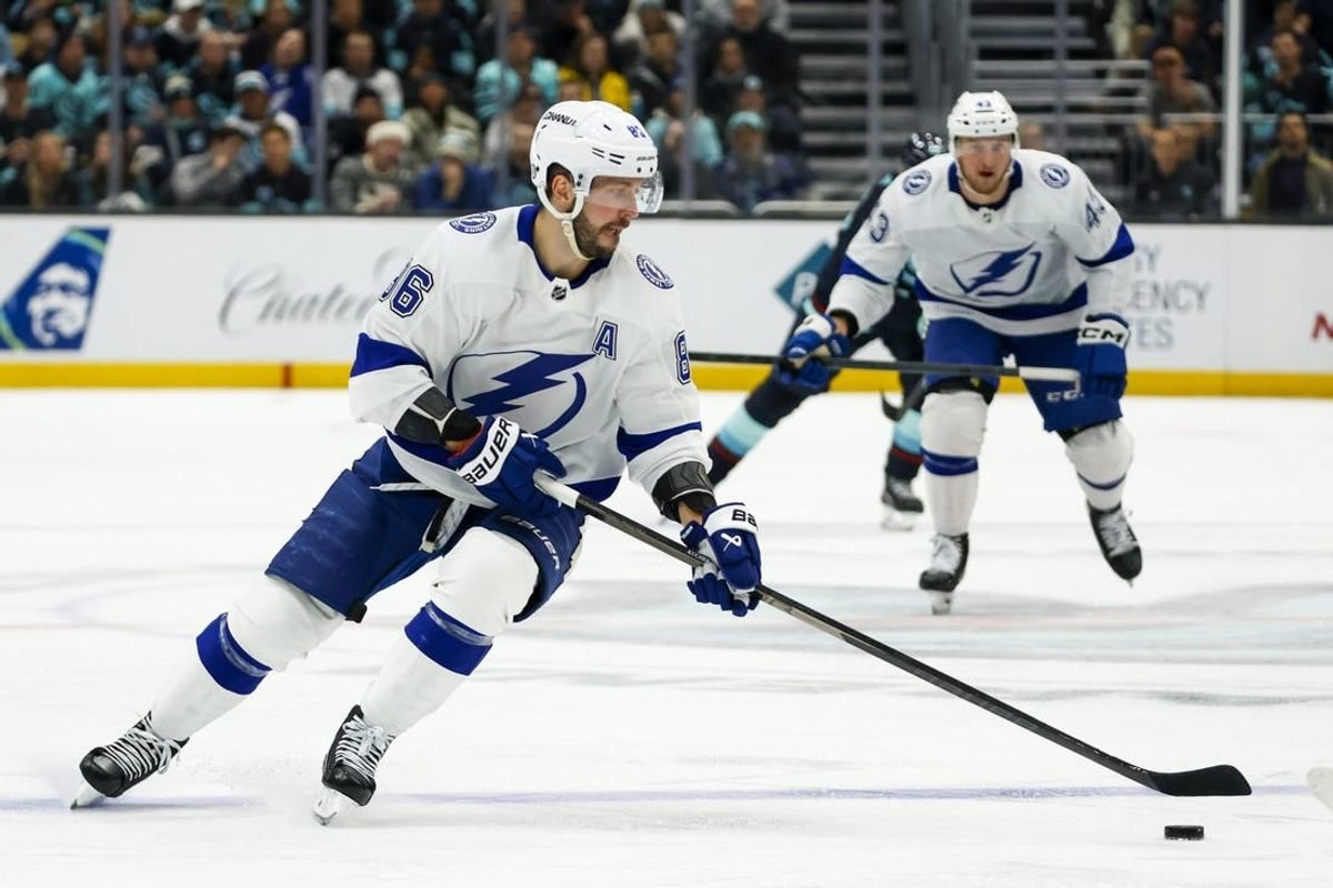 Dec 9, 2023; Seattle, Washington, USA; Tampa Bay Lightning right wing Nikita Kucherov (86) skates with the puck against the Seattle Kraken during the third period at Climate Pledge Arena.