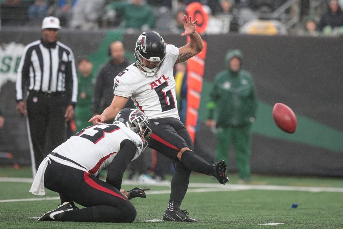 Dec 3, 2023; East Rutherford, New Jersey, USA; Atlanta Falcons place kicker Younghoe Koo (6) kicks a field goal as punter Bradley Pinion (13) holds during the first half against the New York Jets at MetLife Stadium.