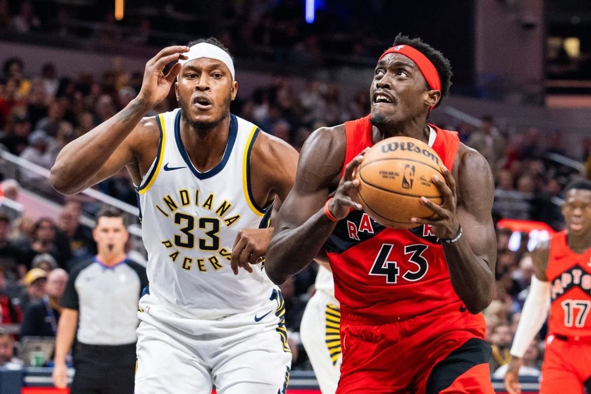 Nov 22, 2023; Indianapolis, Indiana, USA; Toronto Raptors forward Pascal Siakam (43) shoots the ball while Indiana Pacers center Myles Turner (33) defends in the first quarter at Gainbridge Fieldhouse.