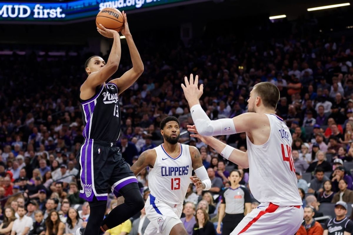 Apr 2, 2024; Sacramento, California, USA; Sacramento Kings forward Keegan Murray (13) shoots the ball over LA Clippers center Ivica Zubac (40) during the second quarter at Golden 1 Center.