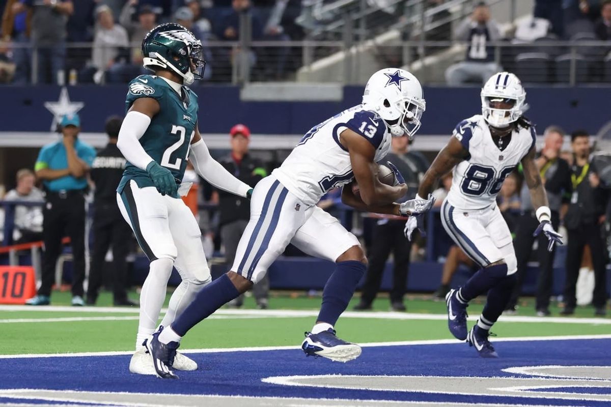 Dec 10, 2023; Arlington, Texas, USA; Dallas Cowboys wide receiver Michael Gallup (13) catches a touchdown pass against Philadelphia Eagles cornerback James Bradberry (24) in the second quarter at AT&T Stadium.