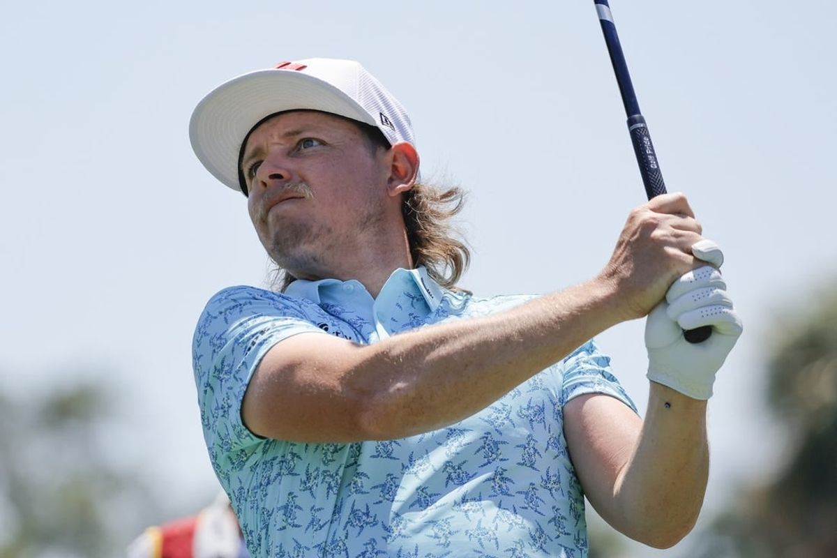 Apr 5, 2024; Miami, Florida, USA; Cameron Smith of the Ripper golf club plays his shot from the fifth tee during the first round of LIV Golf Miami golf tournament at Trump National Doral.