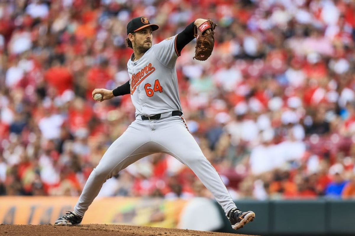 May 5, 2024; Cincinnati, Ohio, USA; Baltimore Orioles starting pitcher Dean Kremer (64) pitches against the Cincinnati Reds in the first inning at Great American Ball Park.