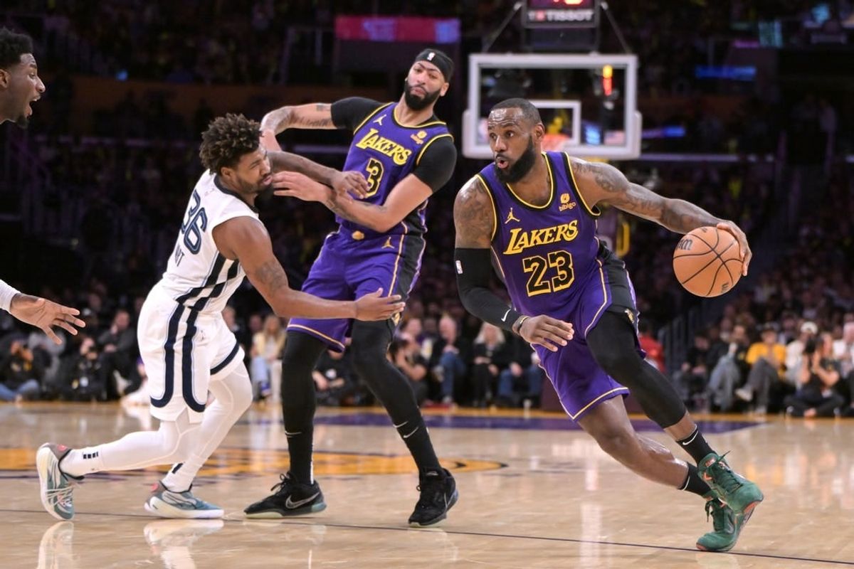 Jan 5, 2024; Los Angeles, California, USA; Los Angeles Lakers forward Anthony Davis (3) screens Memphis Grizzlies guard Marcus Smart (36) as forward LeBron James (23) drives down court in the first half at Crypto.com Arena.