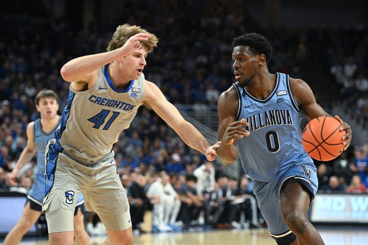 Dec 20, 2023; Omaha, Nebraska, USA;  Villanova Wildcats guard TJ Bamba (0) drives against Creighton Bluejays forward Isaac Traudt (41) in the first half at CHI Health Center Omaha.