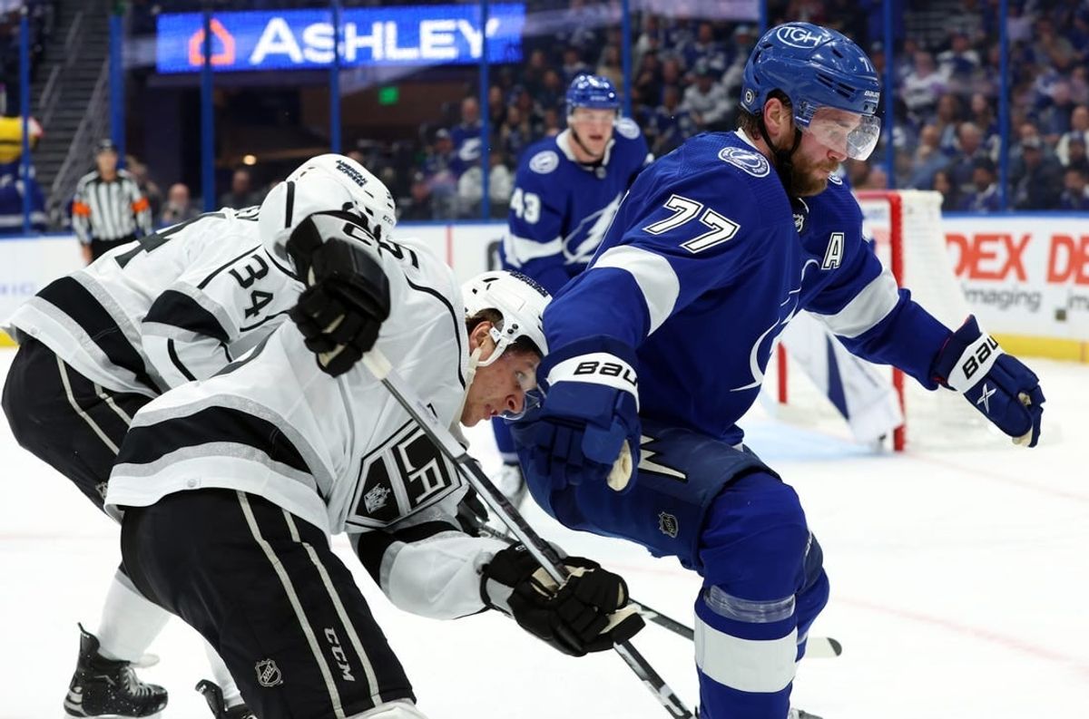 Jan 9, 2024; Tampa, Florida, USA; Tampa Bay Lightning defenseman Victor Hedman (77) defends Los Angeles Kings center Blake Lizotte (46)  during the second period at Amalie Arena.