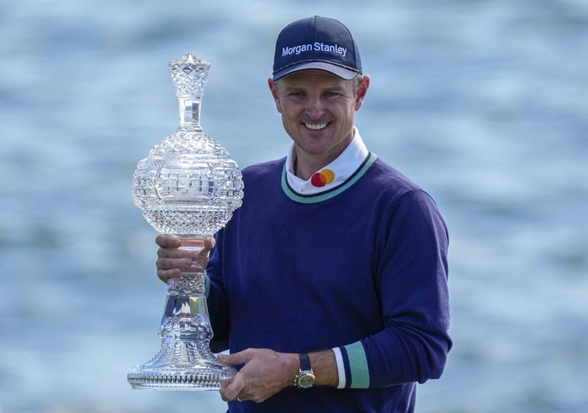 Feb 6, 2023; Pebble Beach, CA, USA; Justin Rose with the championship trophy following the continuation of the final round of the AT&T Pebble Beach Pro-Am golf tournament at Pebble Beach Golf Links.