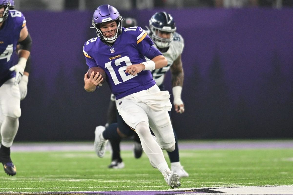 Minnesota Vikings quarterback Nick Mullens (12) runs with the ball against the Tennessee Titans during the second quarter at U.S. Bank Stadium.