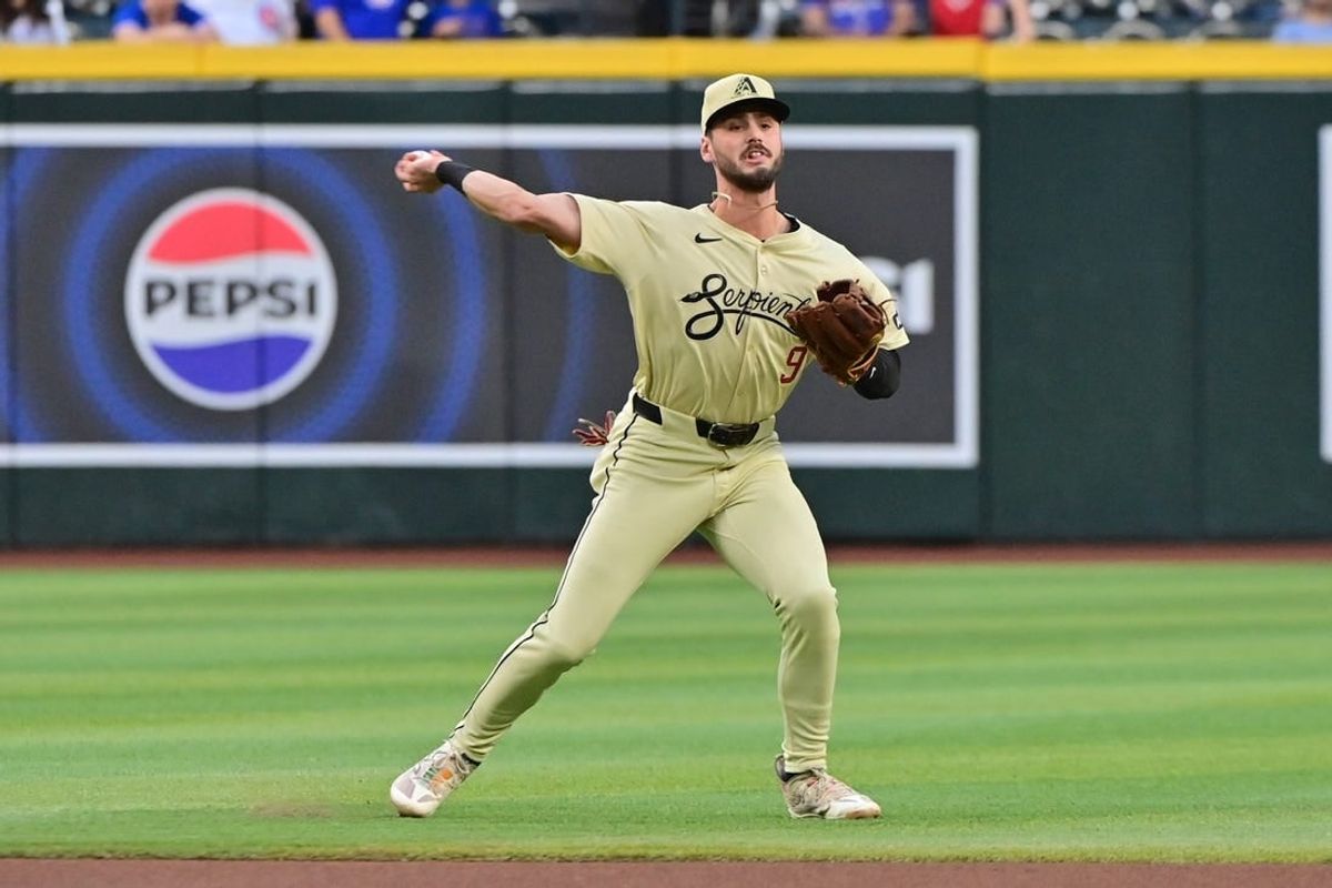 Apr 16, 2024; Phoenix, Arizona, USA; Arizona Diamondbacks shortstop Blaze Alexander (9) throws to first base in the first inning against the Chicago Cubs at Chase Field.