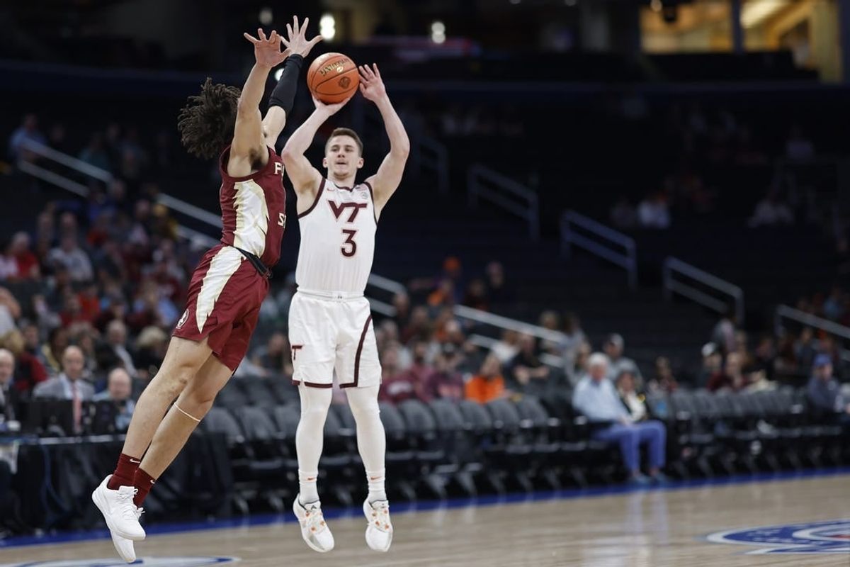 Mar 13, 2024; Washington, D.C., USA; Virginia Tech Hokies guard Sean Pedulla (3) shoots the ball as Florida State Seminoles guard Jalen Warley (1) defends in the first half at Capital One Arena.