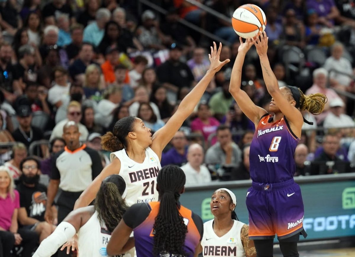 Aug 3, 2023; Phoenix, Arizona, USA; Atlanta Dream center Iliana Rupert (21) defends against Phoenix Mercury guard Moriah Jefferson (8) during the game at at Footprint Center.
