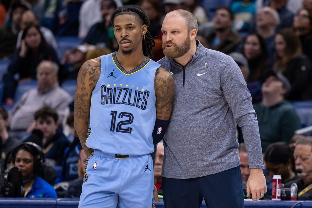 Dec 26, 2023; New Orleans, Louisiana, USA; Memphis Grizzlies head coach Taylor Jenkins talks with guard Ja Morant (12) in the second half against the New Orleans Pelicans at the Smoothie King Center.