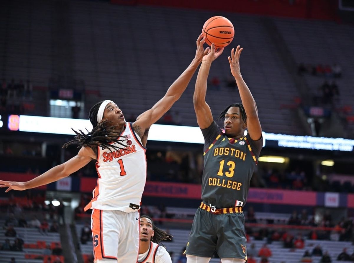 Jan 10, 2024; Syracuse, New York, USA; Syracuse Orange forward Maliq Brown (1) blocks a shot by Boston College Eagles guard Donald Hand Jr. (13) in the first half at the JMA Wireless Dome.