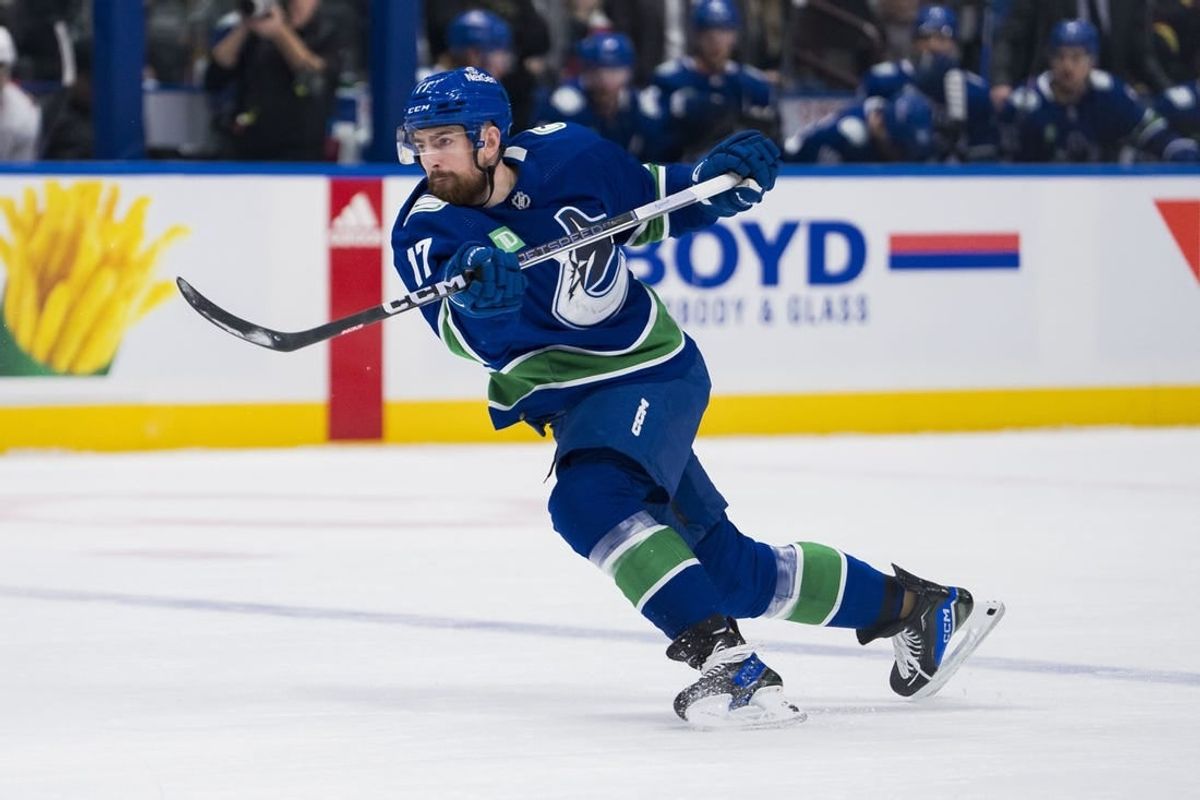 Dec 9, 2023; Vancouver, British Columbia, CAN; Vancouver Canucks defenseman Filip Hronek (17) shoots against the Carolina Hurricanes in the first period at Rogers Arena.