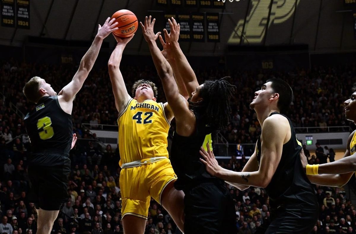 Jan 23, 2024; West Lafayette, Indiana, USA; Michigan Wolverines forward Will Tschetter (42) has a shot blocked by Purdue Boilermakers guard Braden Smith (3) during the first half at Mackey Arena.