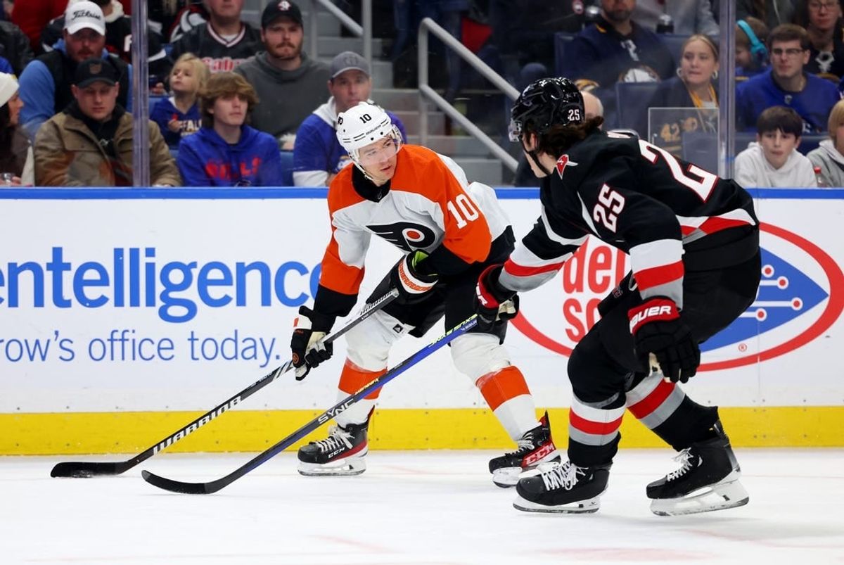 Nov 3, 2023; Buffalo, New York, USA;  Philadelphia Flyers right wing Bobby Brink (10) looks to make a pass as Buffalo Sabres defenseman Owen Power (25) defends during the first period at KeyBank Center.