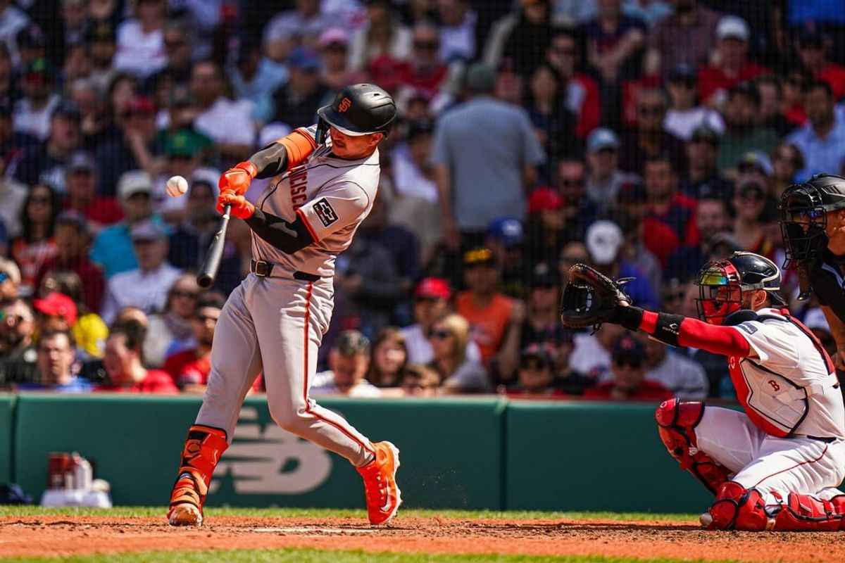 May 2, 2024; Boston, Massachusetts, USA; San Francisco Giants catcher Patrick Bailey (14) gets a base hit against the Boston Red Sox in the seventh inning at Fenway Park.