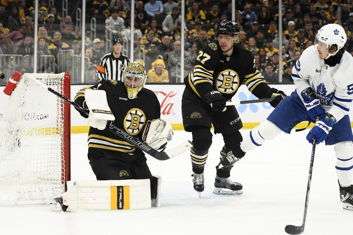 May 4, 2024; Boston, Massachusetts, USA; Boston Bruins goaltender Jeremy Swayman (1) follows the puck while defenseman Hampus Lindholm (27) defends Toronto Maple Leafs left wing Tyler Bertuzzi (59) during the second period in game seven of the first round of the 2024 Stanley Cup Playoffs at TD Garden.
