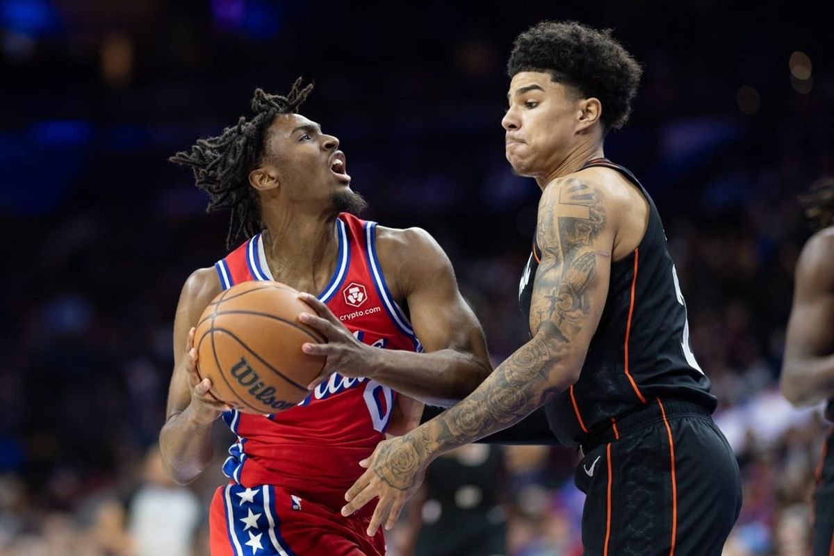 Dec 15, 2023; Philadelphia, Pennsylvania, USA; Philadelphia 76ers guard Tyrese Maxey (0) drives against Detroit Pistons guard Killian Hayes (7) during the first quarter at Wells Fargo Center.