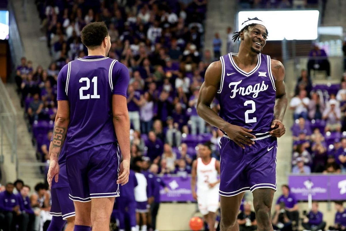 Feb 24, 2024; Fort Worth, Texas, USA; TCU Horned Frogs forward Emanuel Miller (2) celebrates with TCU Horned Frogs forward JaKobe Coles (21) during the second half against the Cincinnati Bearcats at Ed and Rae Schollmaier Arena.