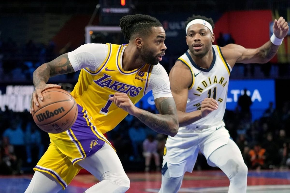 Dec 9, 2023; Las Vegas, Nevada, USA; Los Angeles Lakers guard D'Angelo Russell (1) drives against Indiana Pacers forward Bruce Brown (11) in the third quarter of the in season tournament championship final at T-Mobile Arena.