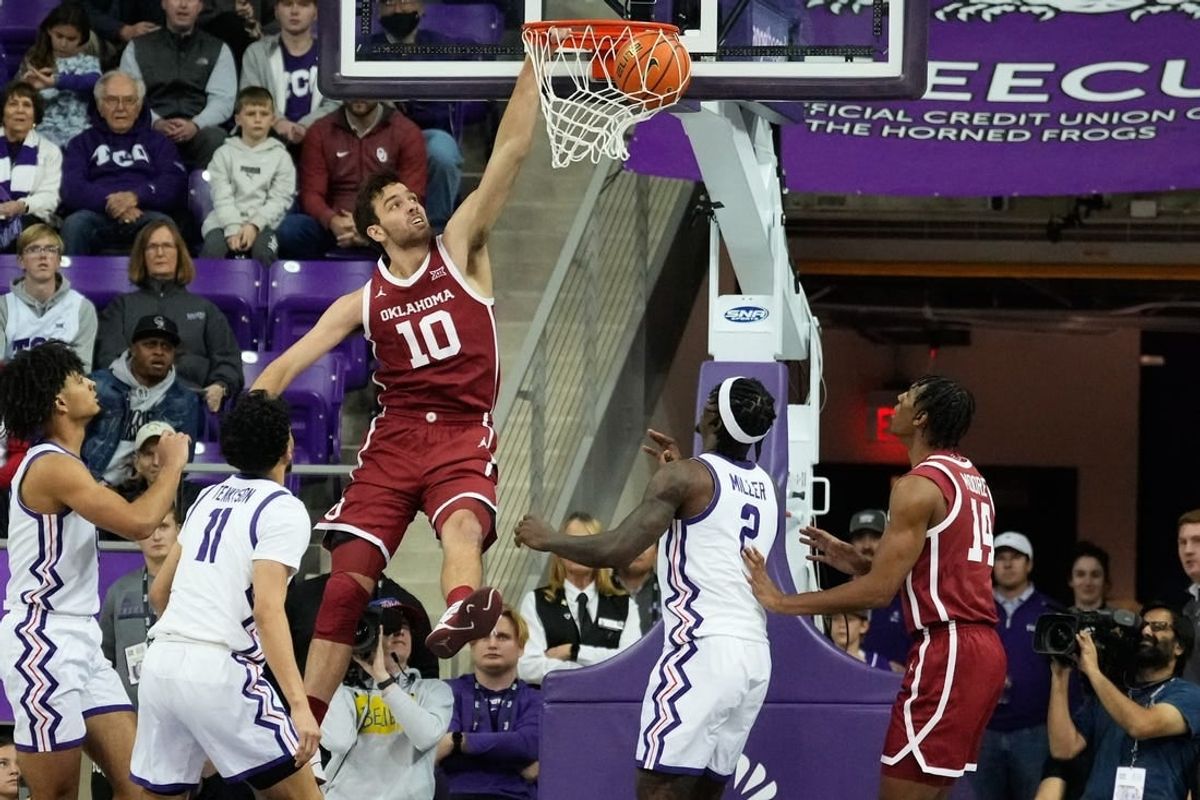 Jan 10, 2024; Fort Worth, Texas, USA; Oklahoma Sooners forward Sam Godwin (10) dunks the ball past TCU Horned Frogs guard Trevian Tennyson (11) during the first half at Ed and Rae Schollmaier Arena.