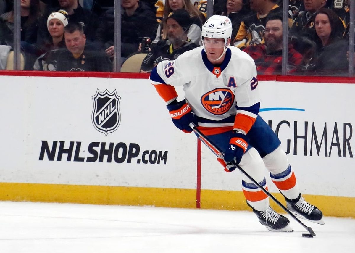 Feb 20, 2024; Pittsburgh, Pennsylvania, USA;  New York Islanders center Brock Nelson (29) moves the puck against the Pittsburgh Penguins during the first period at PPG Paints Arena.
