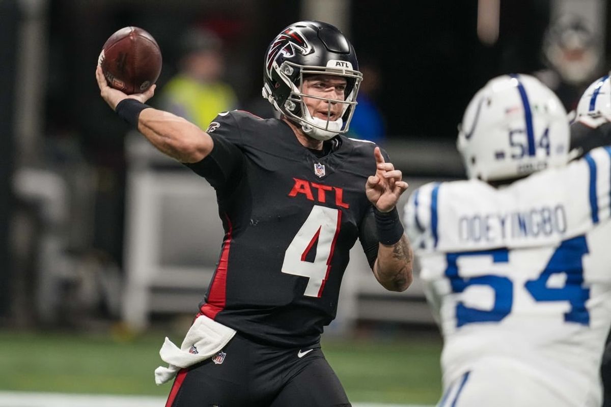 Dec 24, 2023; Atlanta, Georgia, USA; Atlanta Falcons quarterback Taylor Heinicke (4) passes the ball against the Indianapolis Colts during the first half at Mercedes-Benz Stadium.