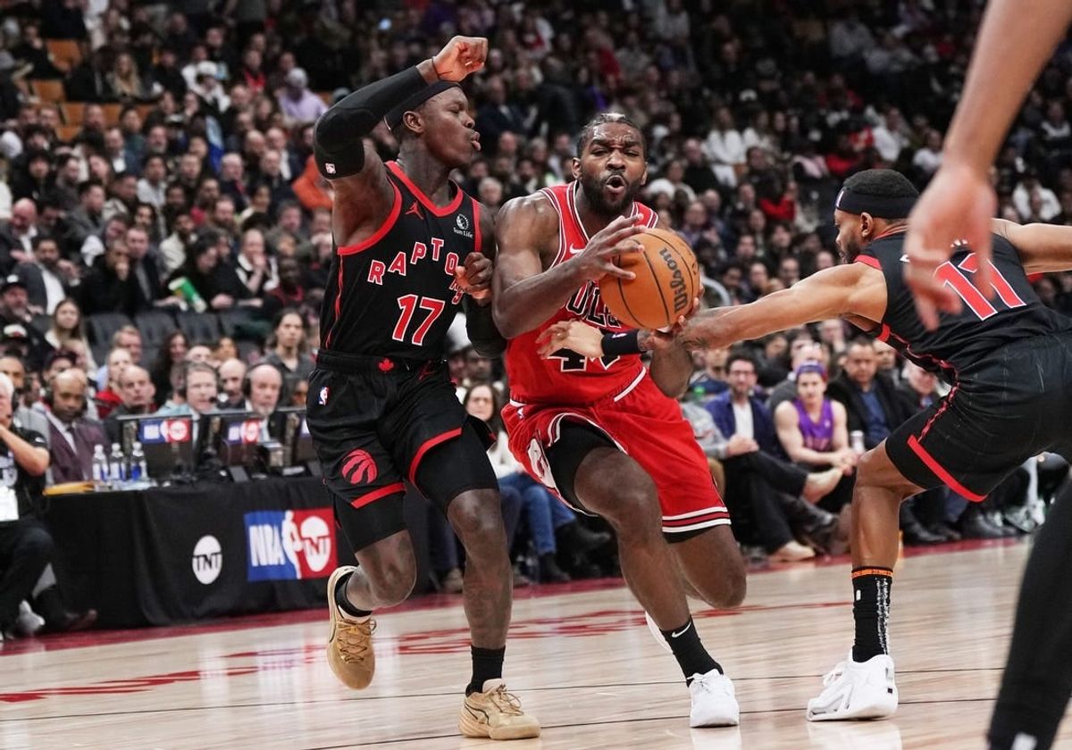 Jan 18, 2024; Toronto, Ontario, CAN; Chicago Bulls forward Patrick Williams (44) controls the ball between Toronto Raptors guard Dennis Schroder (17) and guard Bruce Brown (11) during the third quarter at Scotiabank Arena.