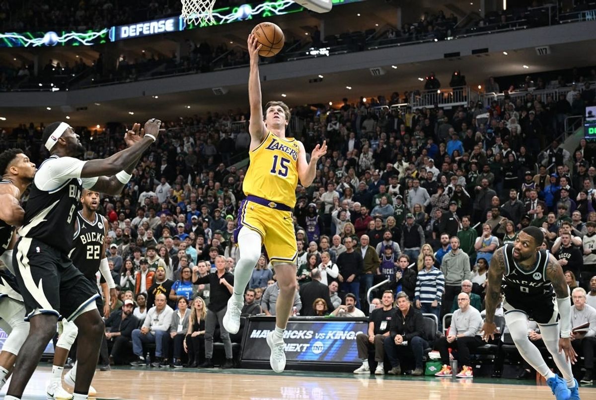Mar 26, 2024; Milwaukee, Wisconsin, USA; Los Angeles Lakers guard Austin Reaves (15) drives to the basket in the second half at Fiserv Forum.
