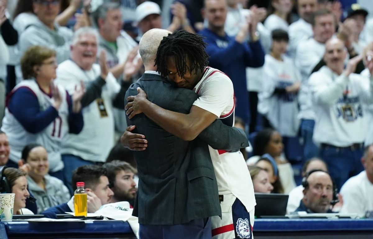 Mar 3, 2024; Storrs, Connecticut, USA; UConn Huskies head coach Dan Hurley hugs guard Tristen Newton (2) as he comes off the court during his final home game as they take on the Seton Hall Pirates at Harry A. Gampel Pavilion.