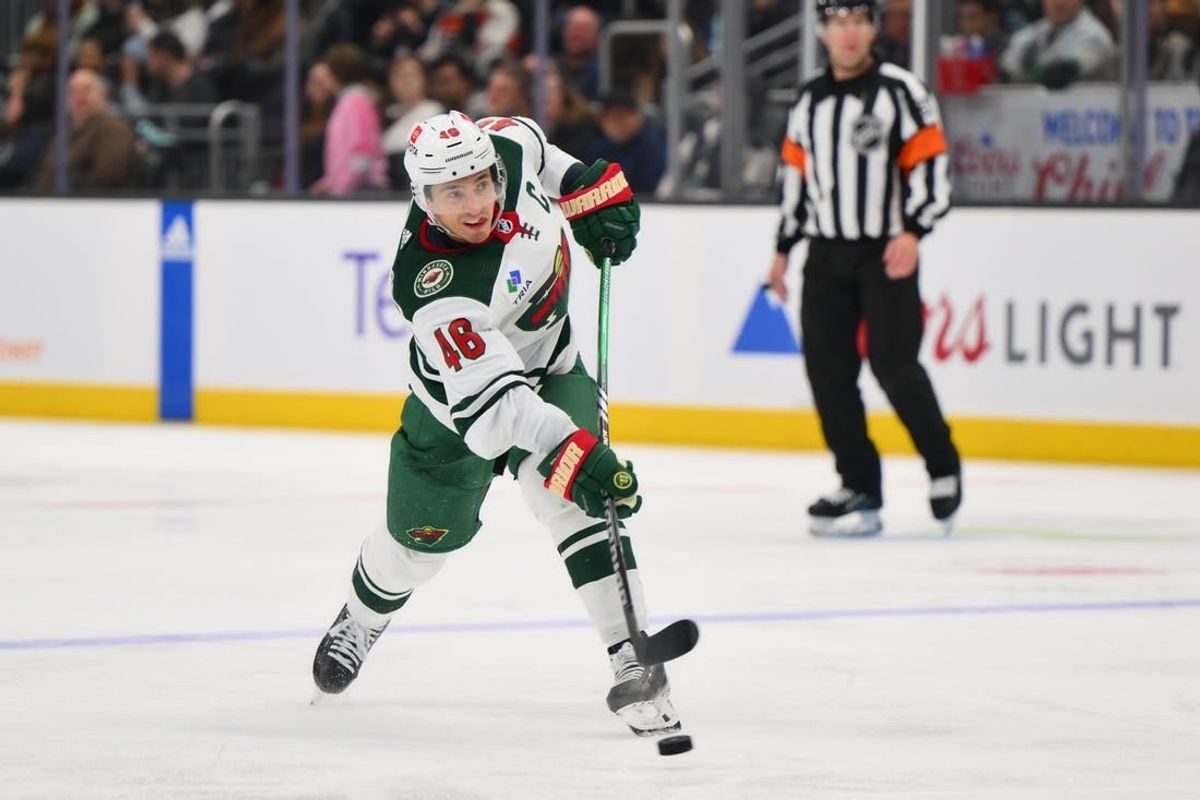 Dec 10, 2023; Seattle, Washington, USA; Minnesota Wild defenseman Jared Spurgeon (46) shoots the puck against the Seattle Kraken during the third period at Climate Pledge Arena.