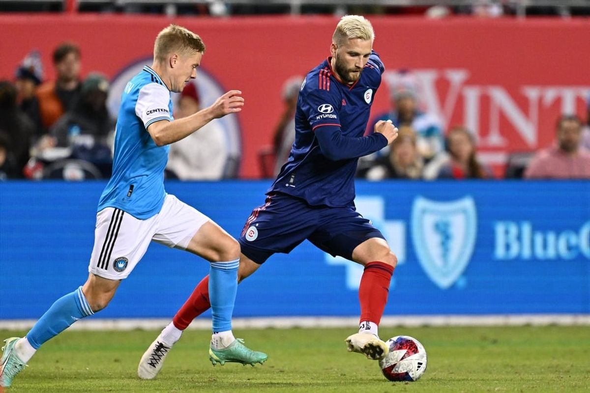 Oct 7, 2023; Chicago, Illinois, USA;  Chicago Fire FC forward Kacper Przybylko (11) controls the ball against Charlotte FC defender Jere Uronen (3) in the second half at Soldier Field.