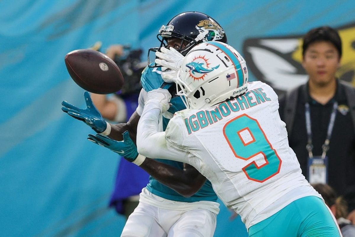 Aug 26, 2023; Jacksonville, Florida, USA;  Jacksonville Jaguars wide receiver Calvin Ridley (0) makes a catch defended by Miami Dolphins cornerback Noah Igbinoghene (9) in the second quarter at EverBank Stadium.