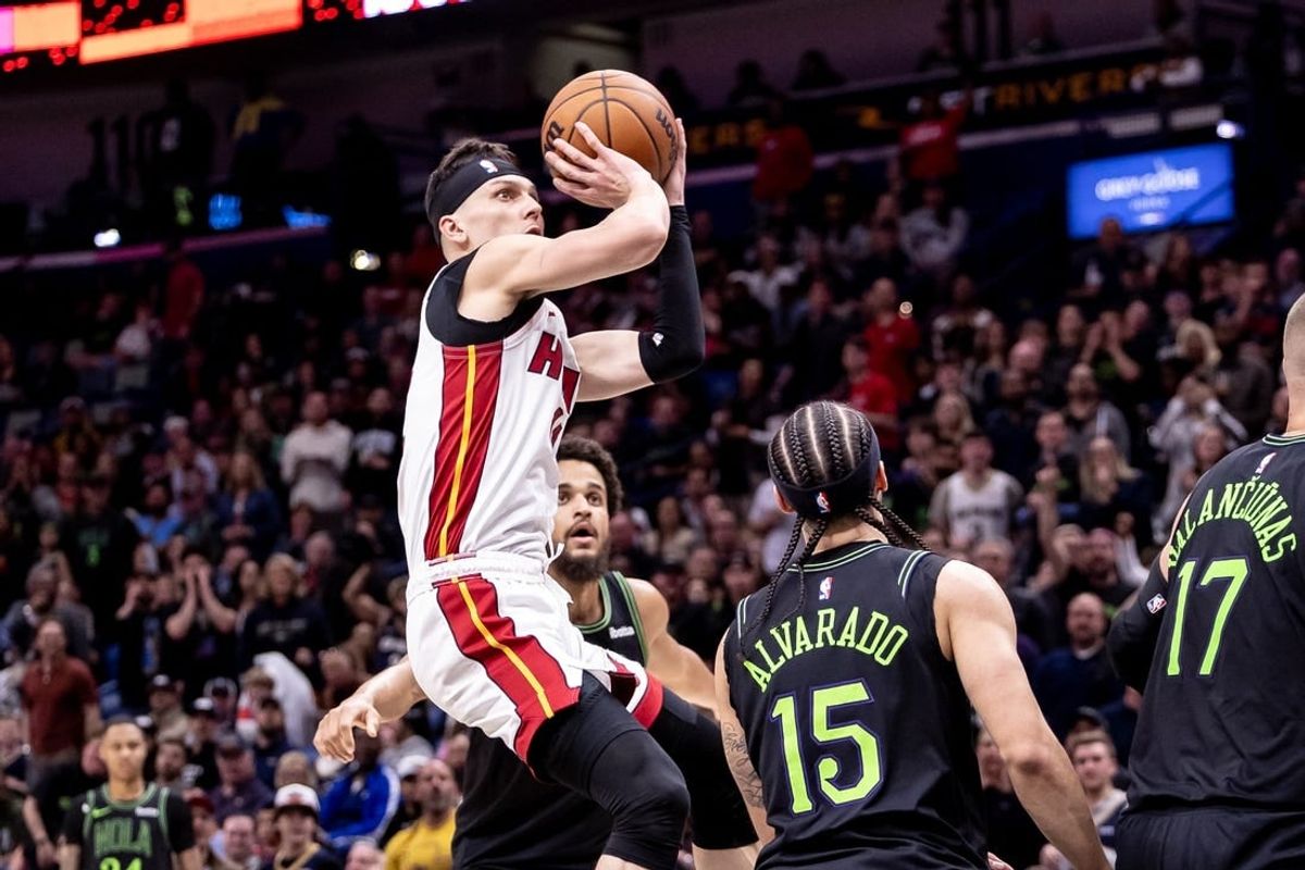 Feb 23, 2024; New Orleans, Louisiana, USA;  Miami Heat guard Tyler Herro (14) shoots a jump shot against the New Orleans Pelicans during the first half at Smoothie King Center.